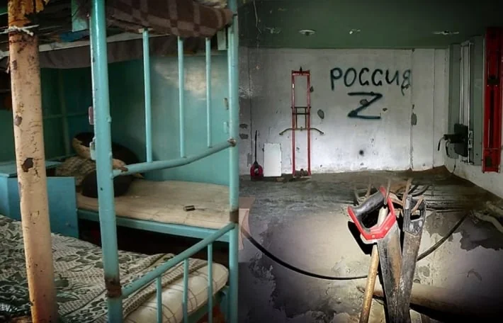 Занедбана камера з двоярусними ліжками та графіті Росія Z на стіні